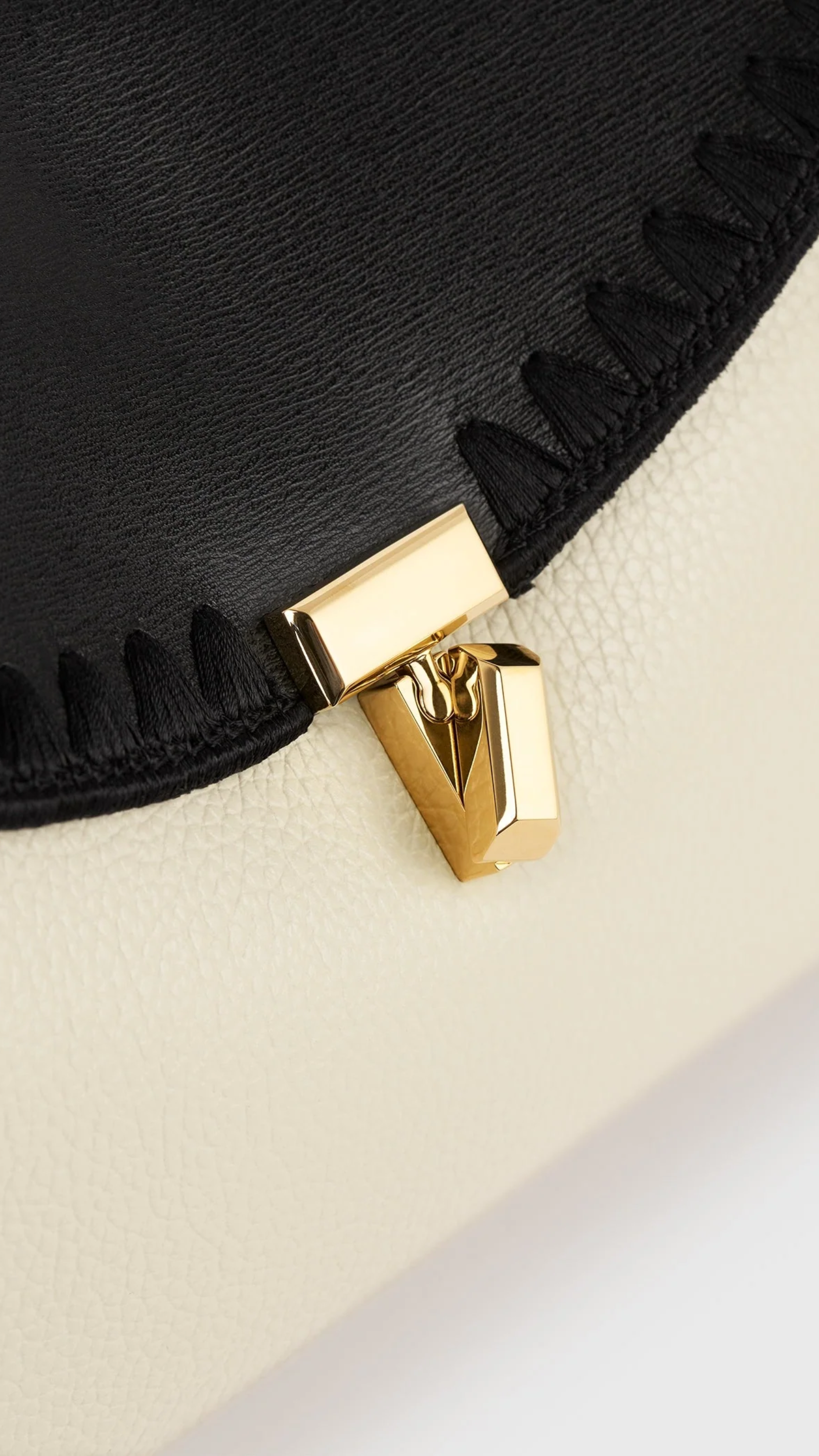 Toteme T-lock Embroidered Leather Clutch in Black Milk