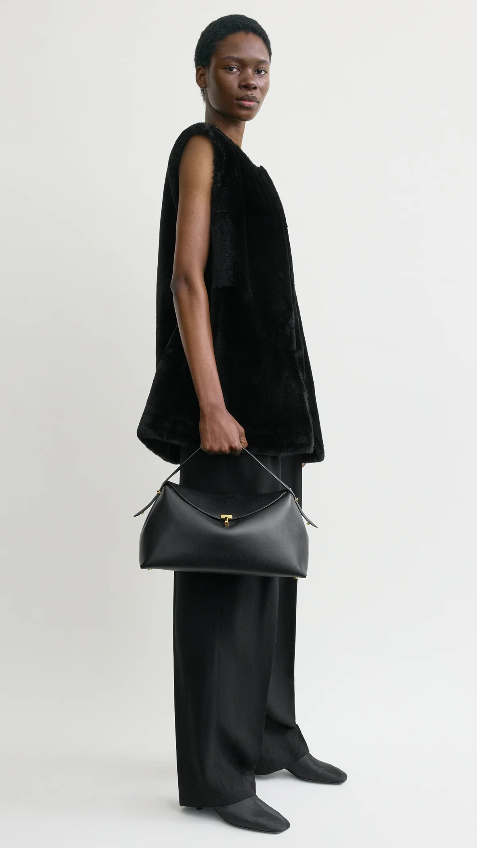 Toteme T-lock Leather Top Handle Bag in Black