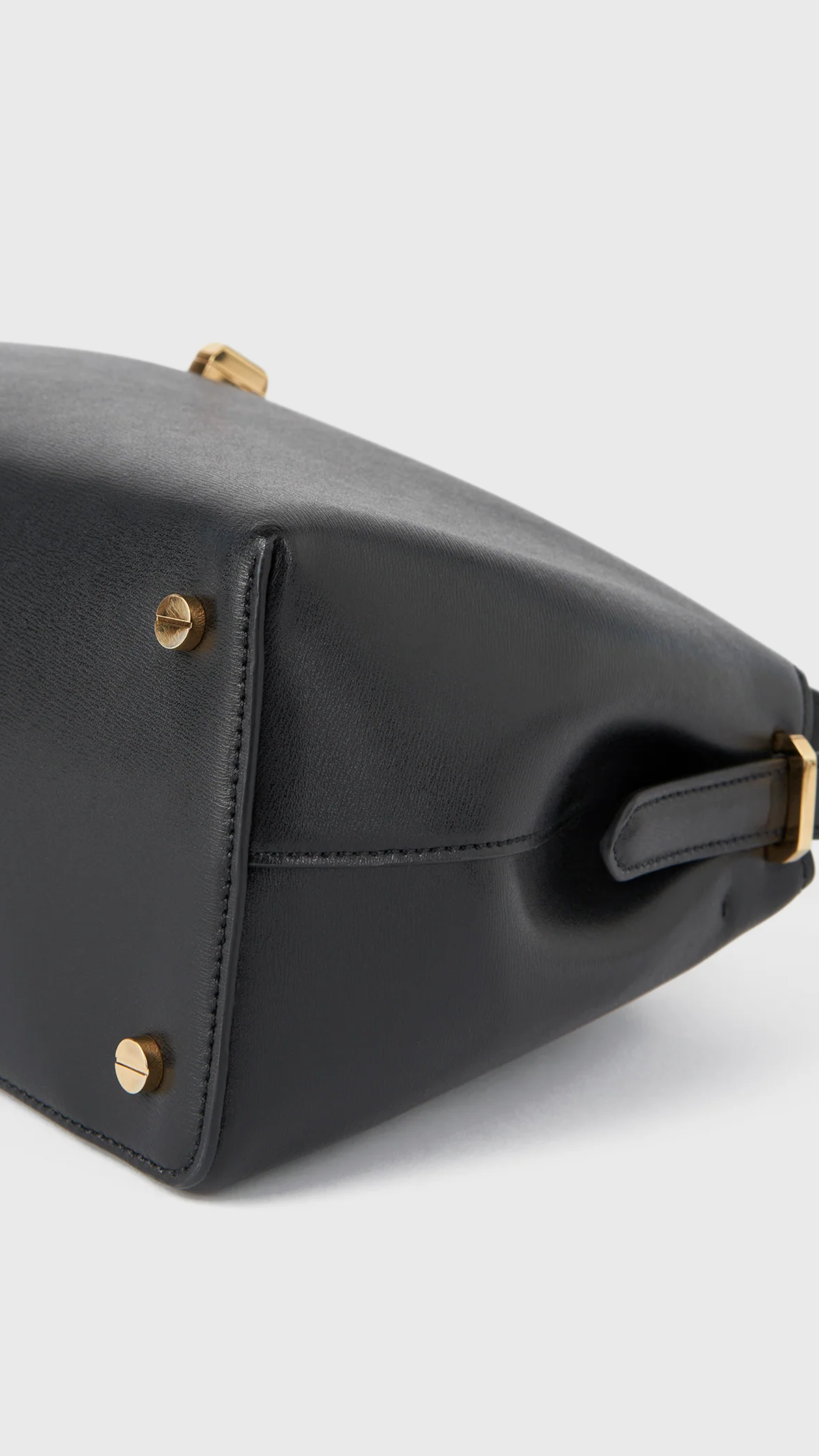 Toteme T-lock Leather Top Handle Bag in Black