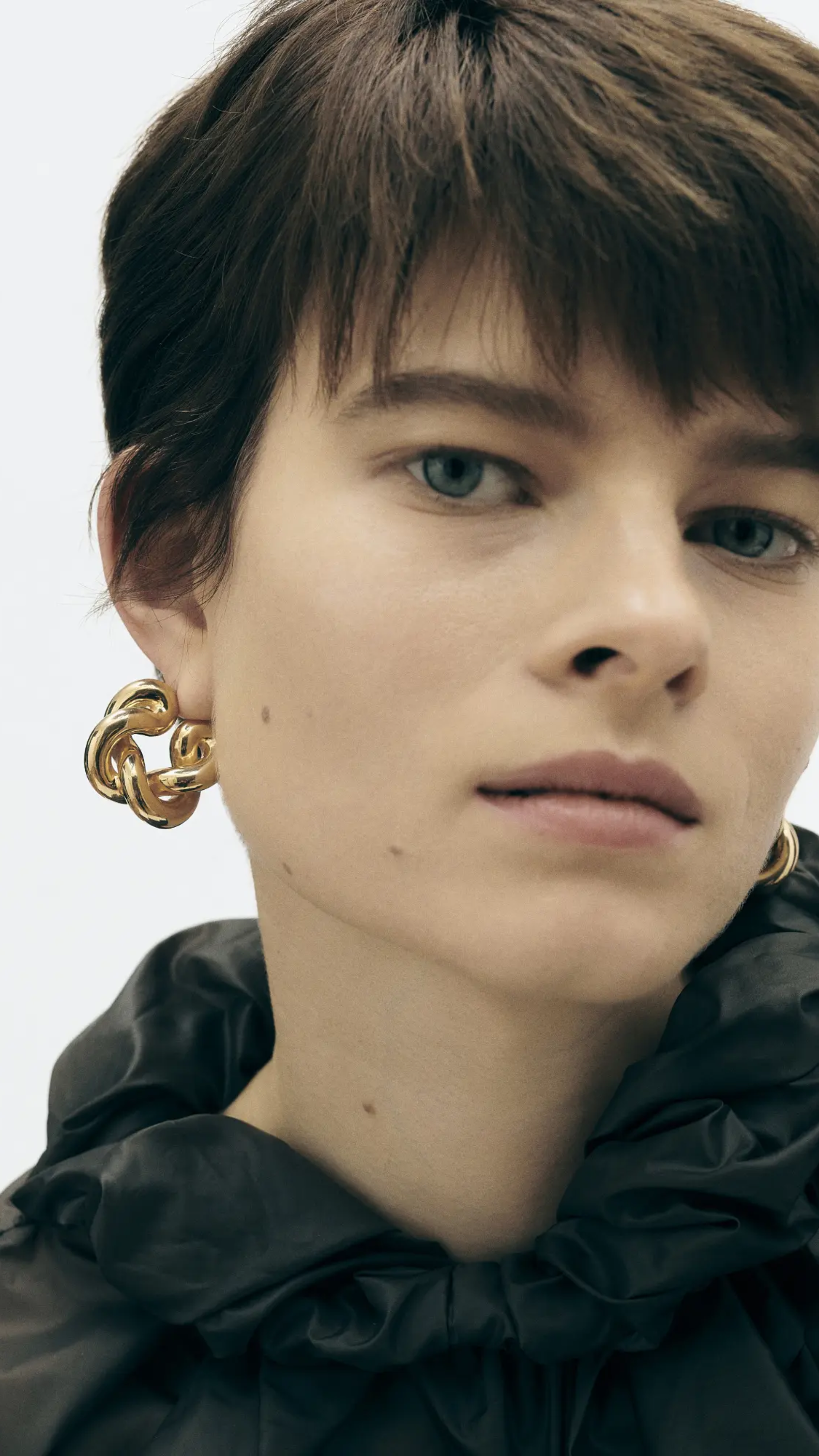 Uncommon Matters Twist Creoles Earrings in Gold