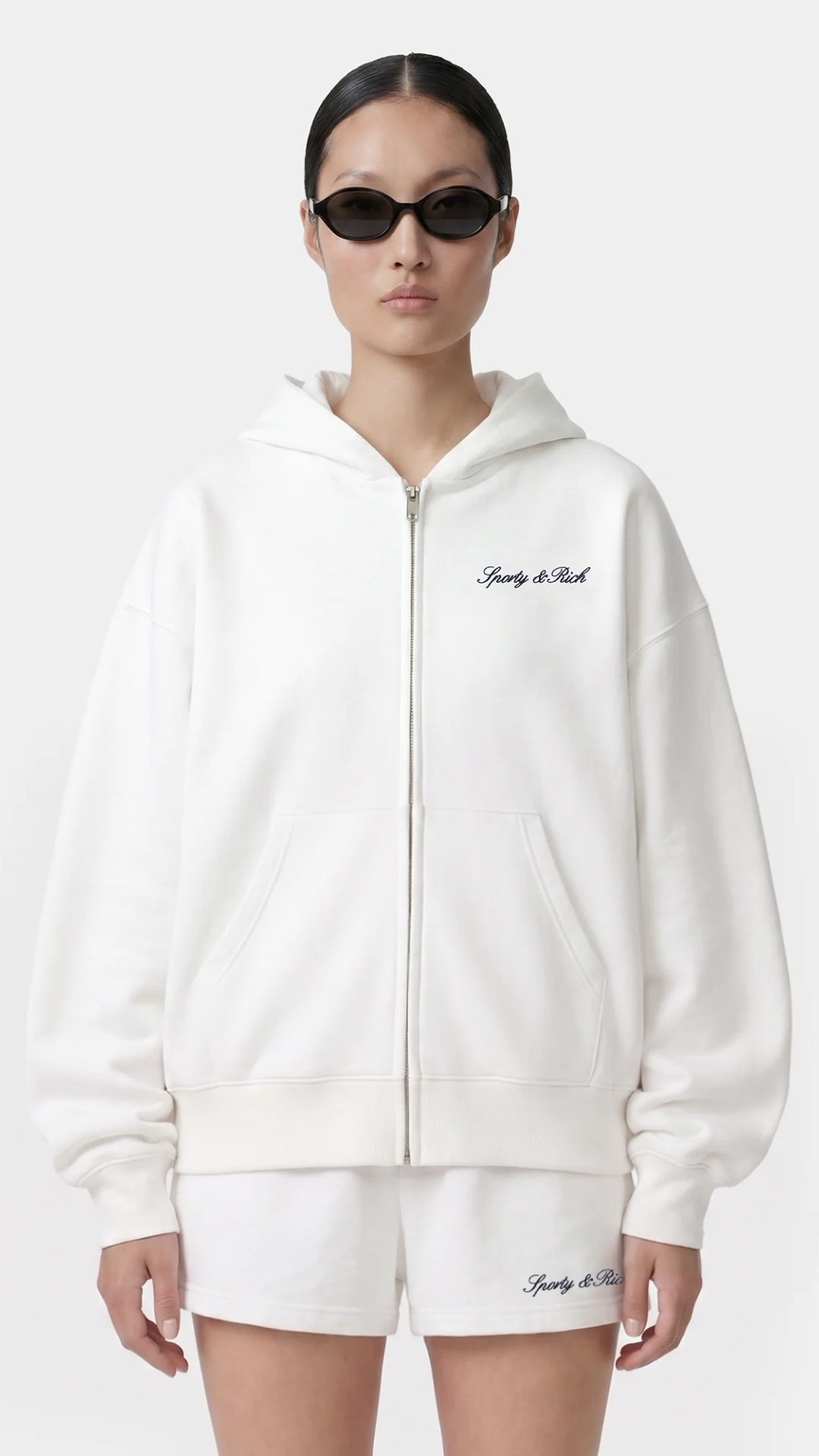 Sporty & Rich Signature Logo Embroidered Zip Hoodie in White/Navy