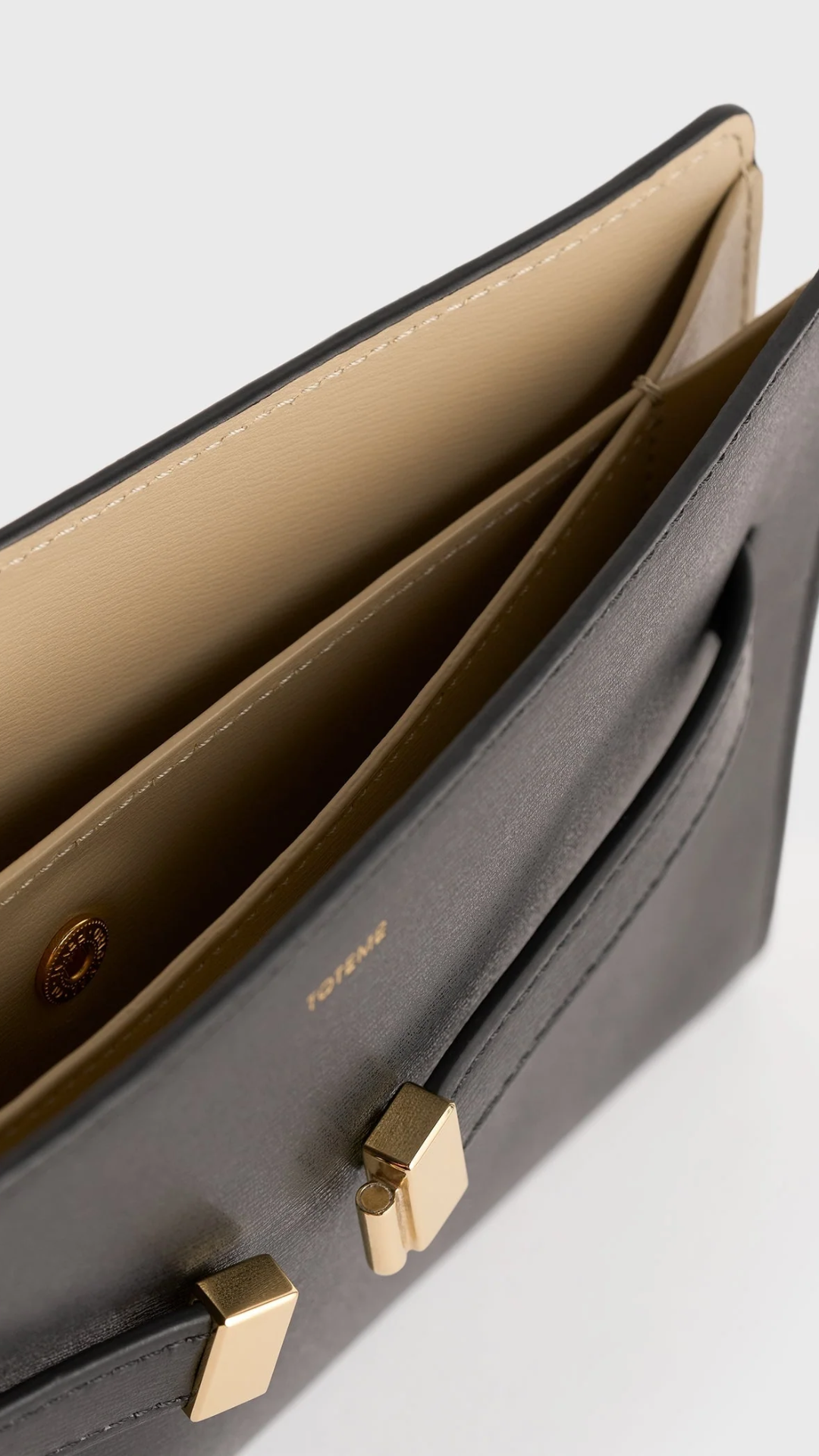 Toteme Belted Leather Cross-body Bag in Black