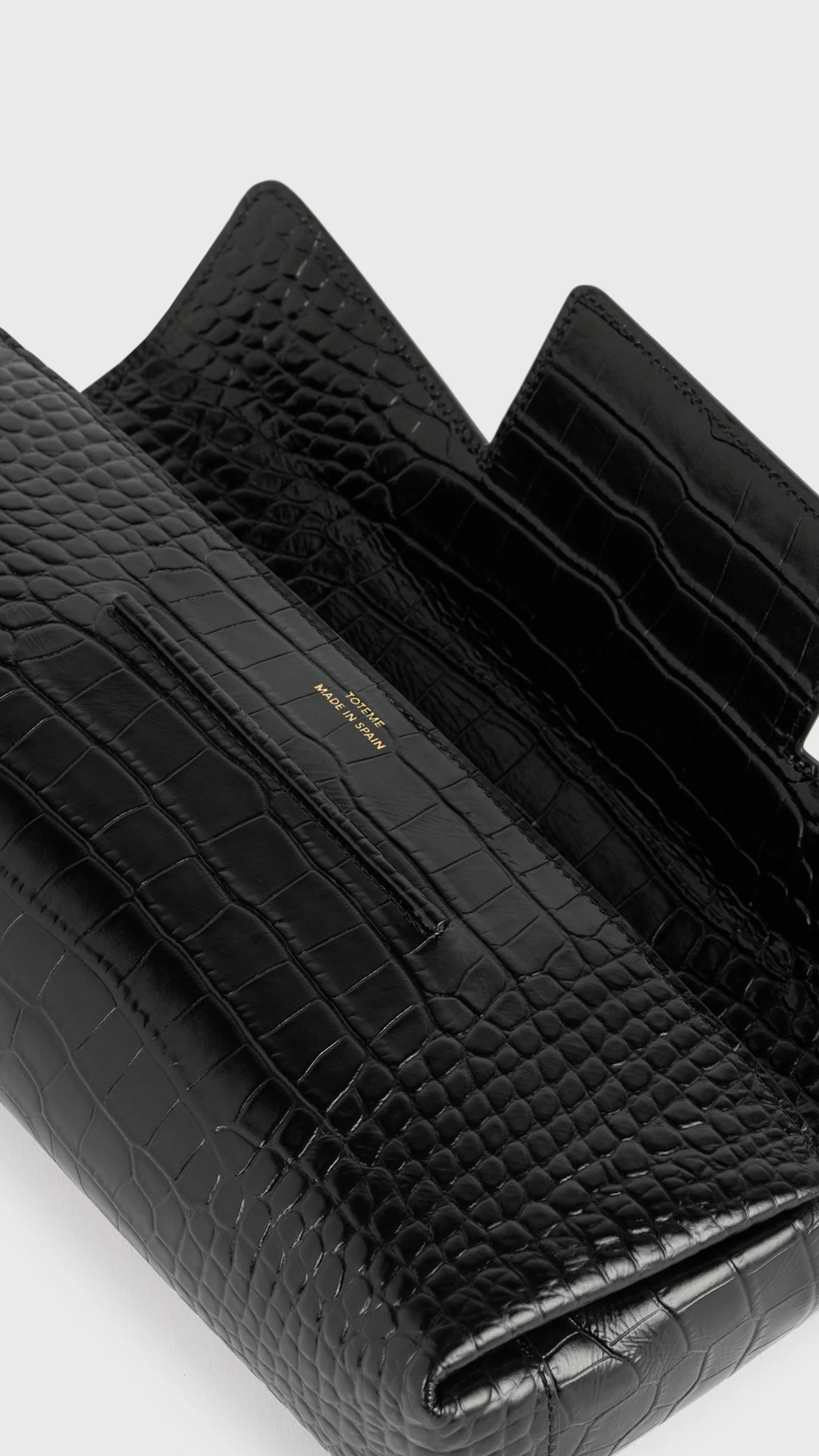 Toteme Soft Croco-embossed T-clutch in Black