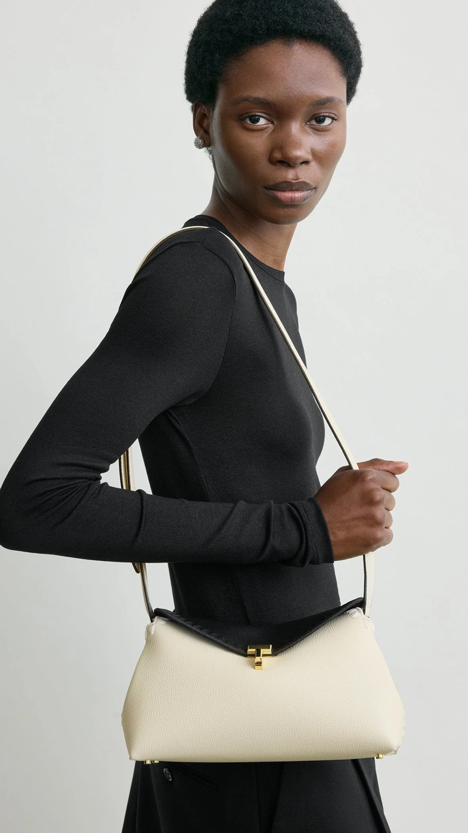 Toteme T-lock Embroidered Leather Clutch in Black Milk