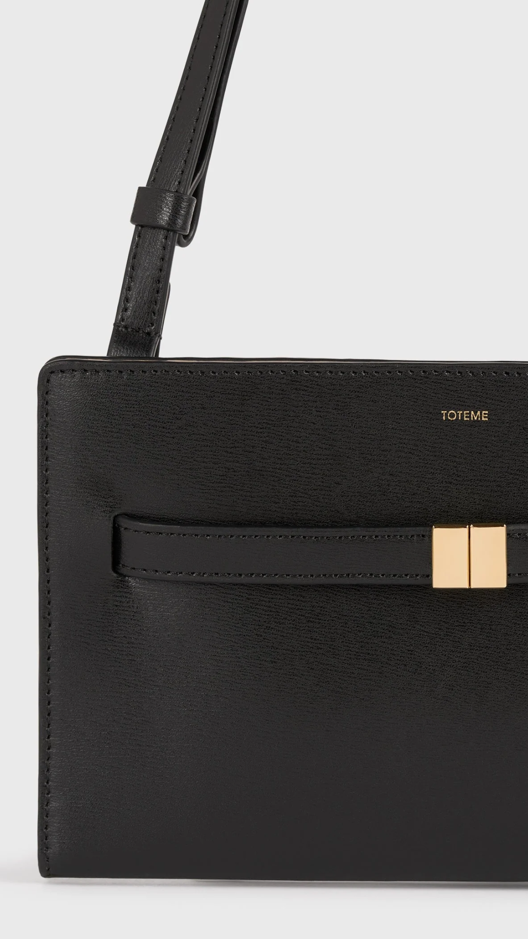 Toteme Belted Leather Cross-body Bag in Black