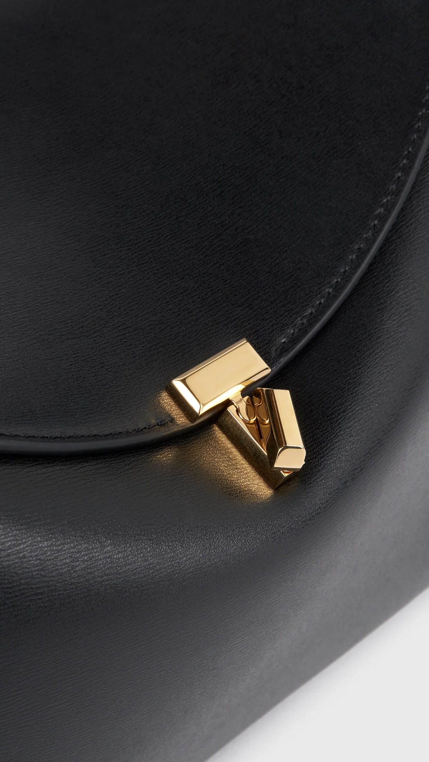 Toteme T-lock Leather Top Handle Bag in Black