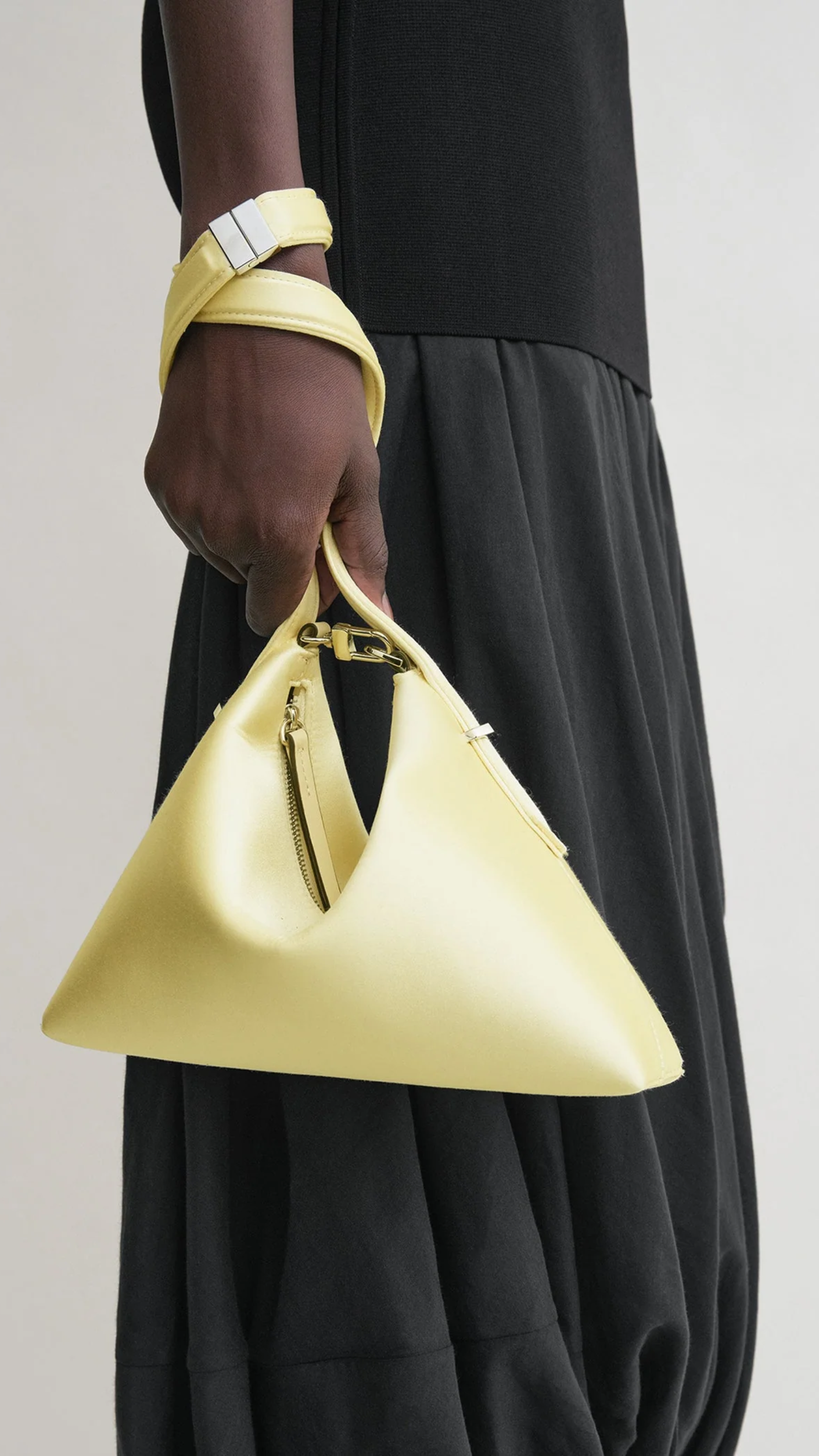 Toteme Bevel Satin Wristlet in Pale Yellow