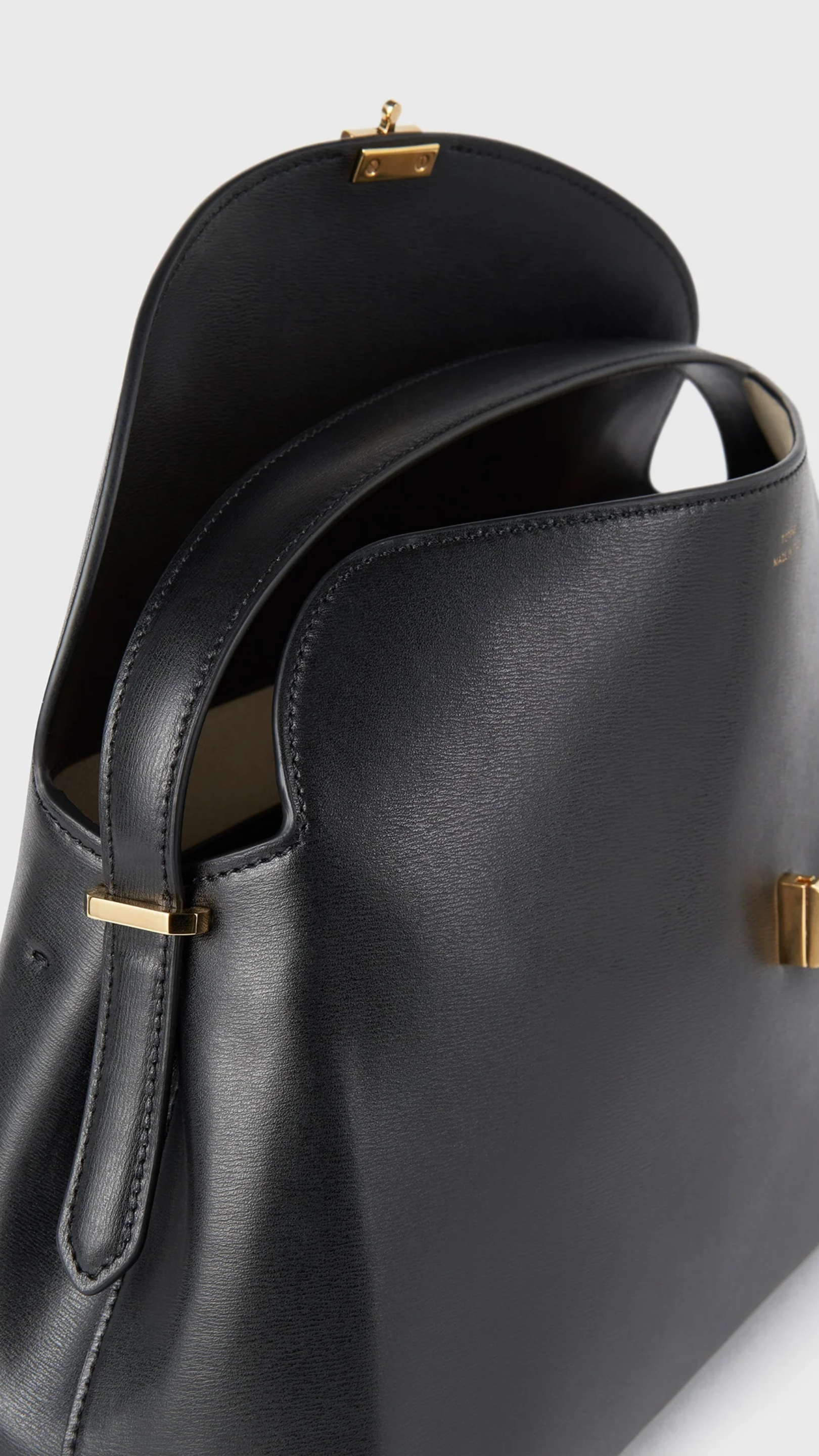 Toteme T-lock Leather Top Handle Bag in Black