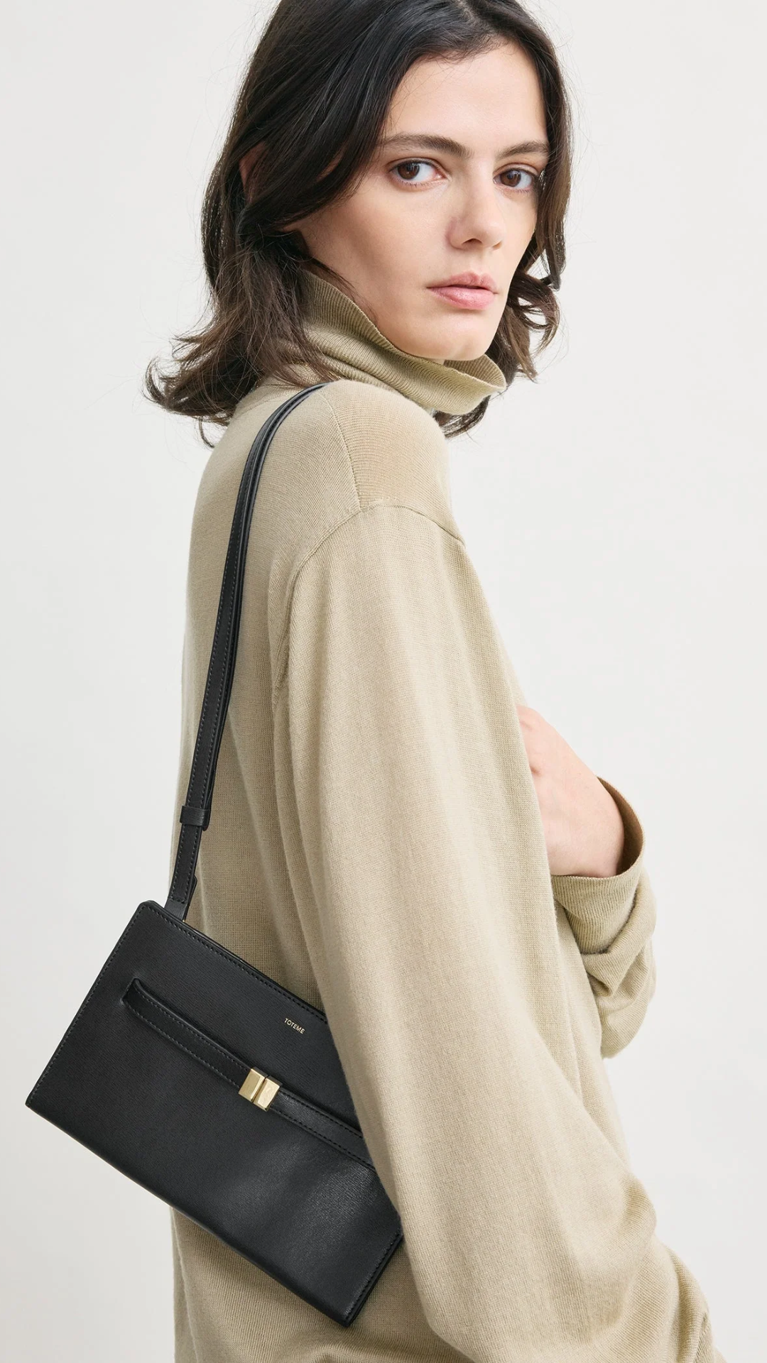 Toteme Belted Leather Cross-body Bag in Black