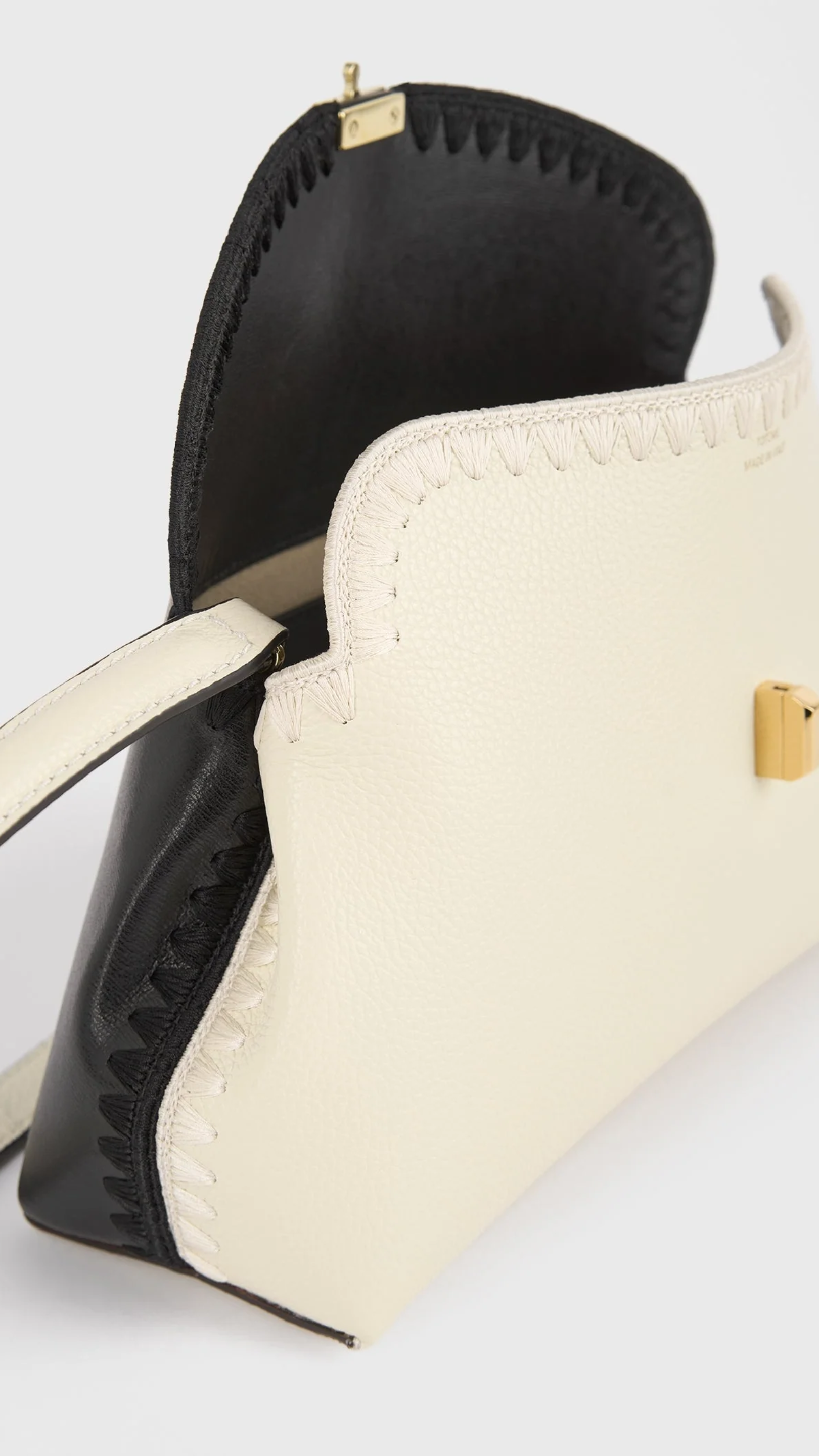 Toteme T-lock Embroidered Leather Clutch in Black Milk