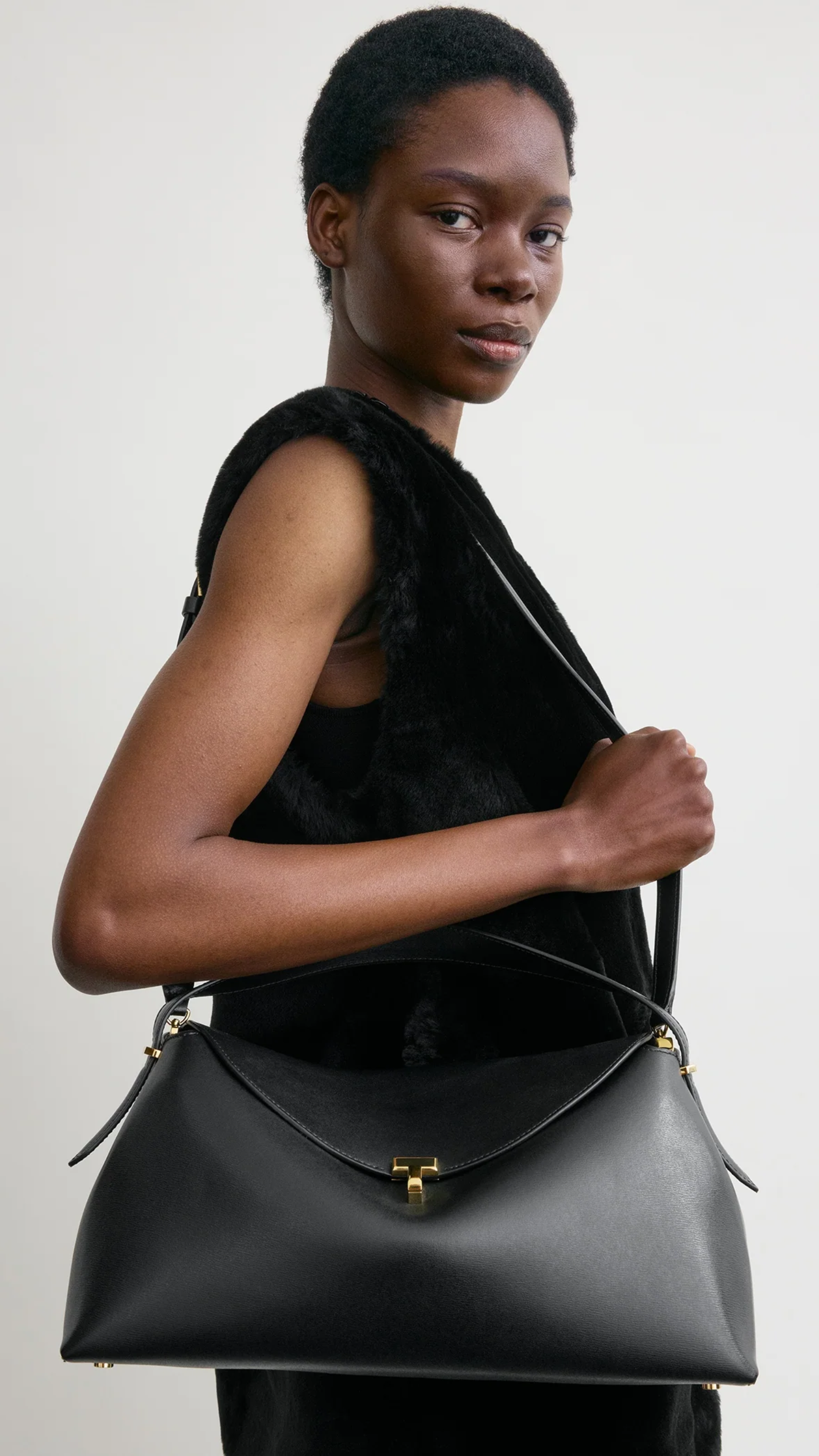 Toteme T-lock Leather Top Handle Bag in Black