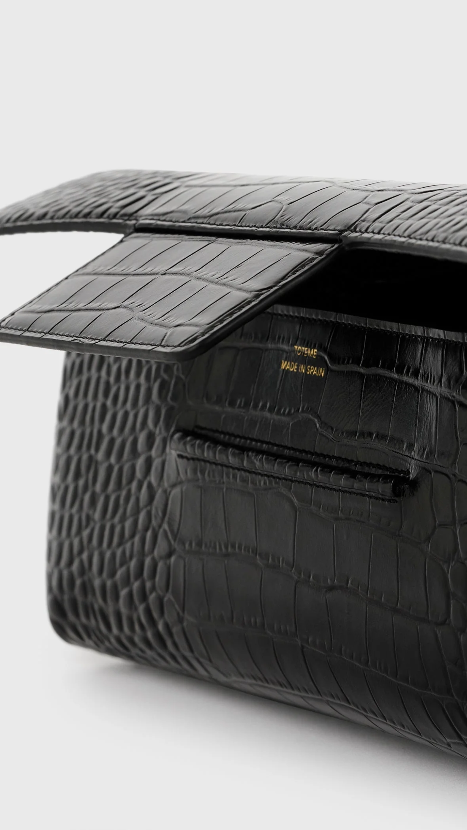 Toteme Soft Croco-embossed T-clutch in Black